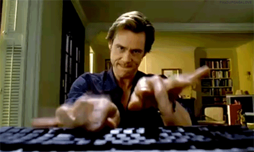 Gif Jim Carrey escribiendo en la computadora.